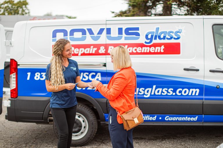 a Novus Glass lady greeting a customer